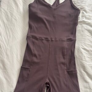 Travis Mathew Sleeveless Bodysuit Romper in Mauve Plum